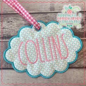 1975 Tag Oval Scallop Applique Design